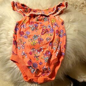A garanimals onsie size 0-3months